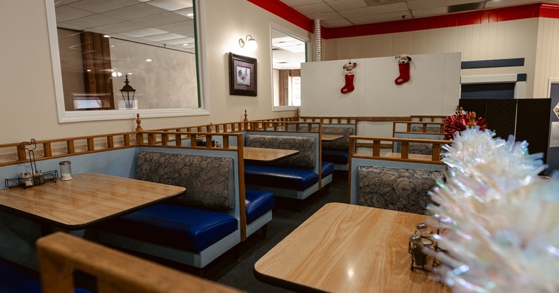 Cozy dining area, upholstered dining booths ready for guests