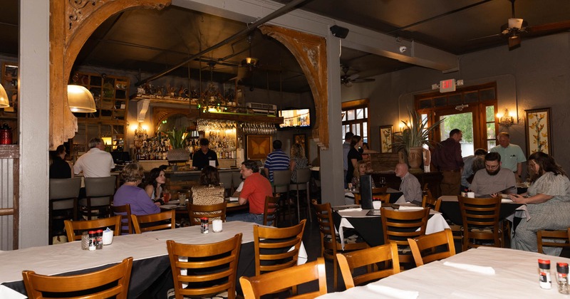 Interior, tables and chairs, guests sitting and chatting