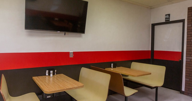 Interior, tables and seating, wall TV screen