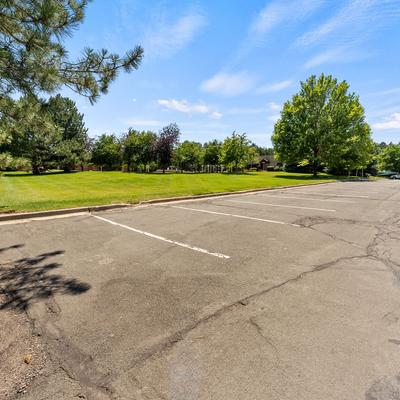 Empty parking space near grass