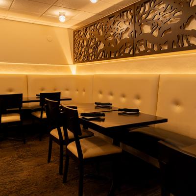 Interior, cozy dining area with set tables.