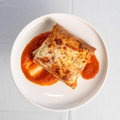 Slice of Sicilian Cheese Pizza.