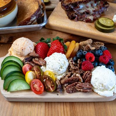 Cheese, fruit, nut, and veggie board.