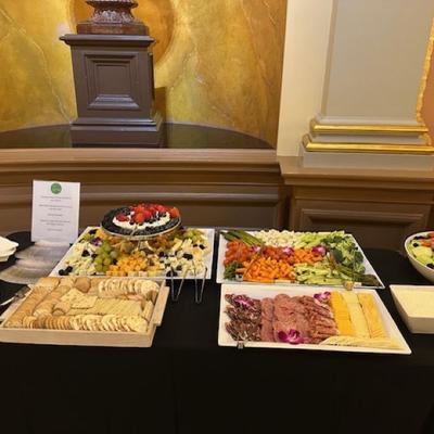 A catered buffet spread featuring a variety of appetizers in an elegant setting.