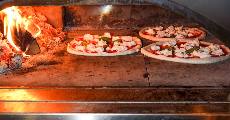 Pizza cooking in an oven