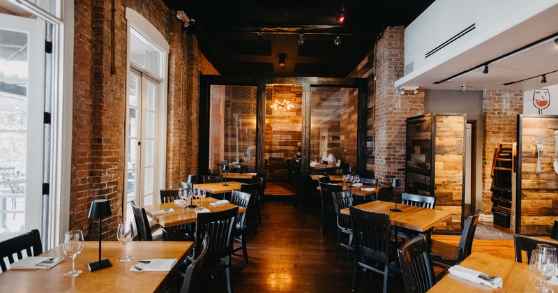 Modern and cozy interior dining area with tables ready for guests