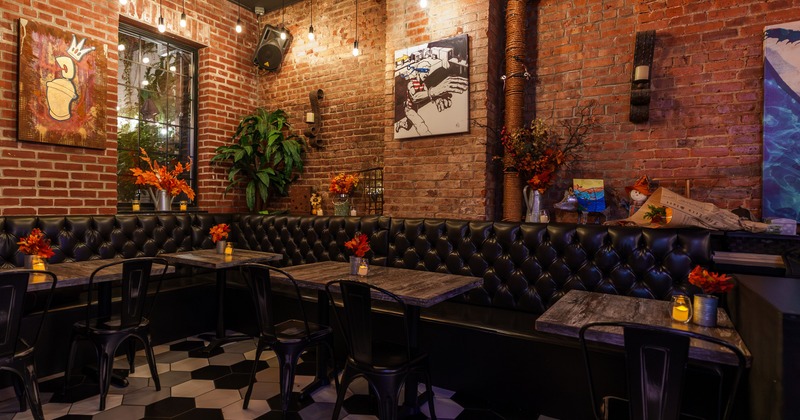 Interior, seating space with leather lounge couch and tables