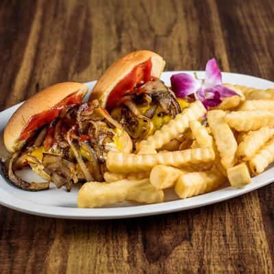 Beef sliders topped with grilled onion and served with crinkle-cut fries.