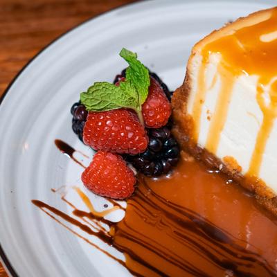 Caramel cheesecake and berries, closeup.