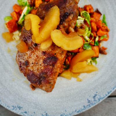 Pork chop, with sweet potato, brussels sprouts, candied pecans, and hot honey apples.