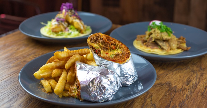 A large burrito and french fries