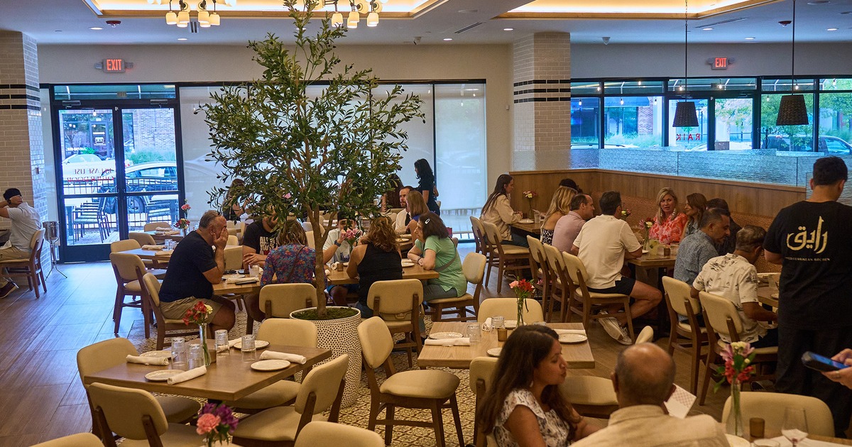 Guests in a dining area inside
