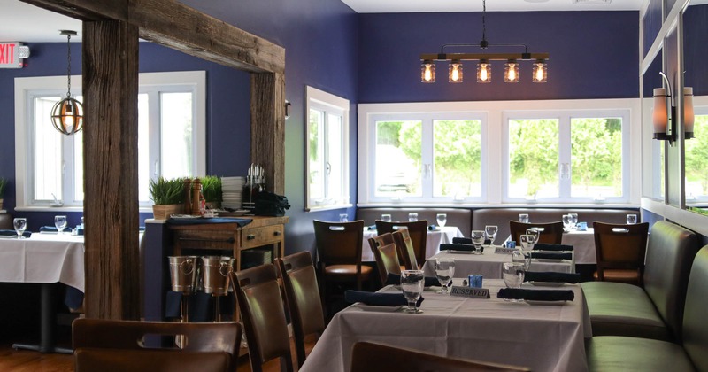 Interior, dining area, waiter serving station, old wooden beams, chandelier, wall lamp