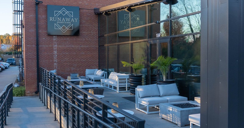 Exterior, patio, seating area, tables and chairs, sofas with coffee tables, restaurant front