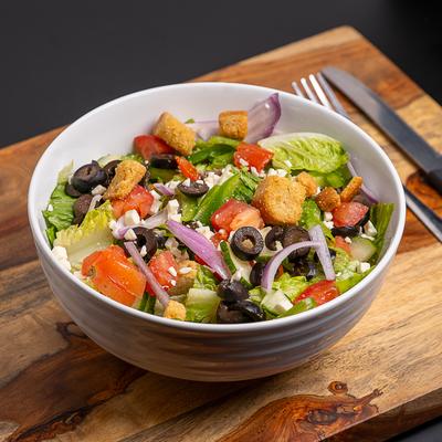 Greek Salad with croutons amd cheese crumbles.
