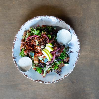 Brisket Apple Bacon Salad served with creamy gorgonzola dressing.