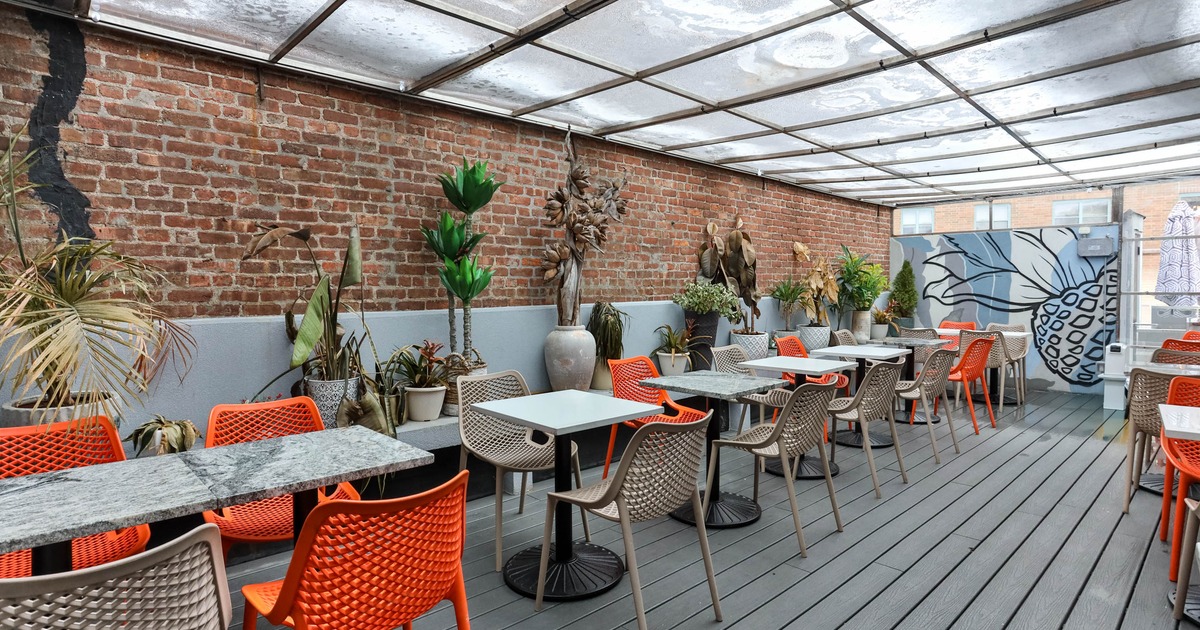 Covered patio with chairs and tables