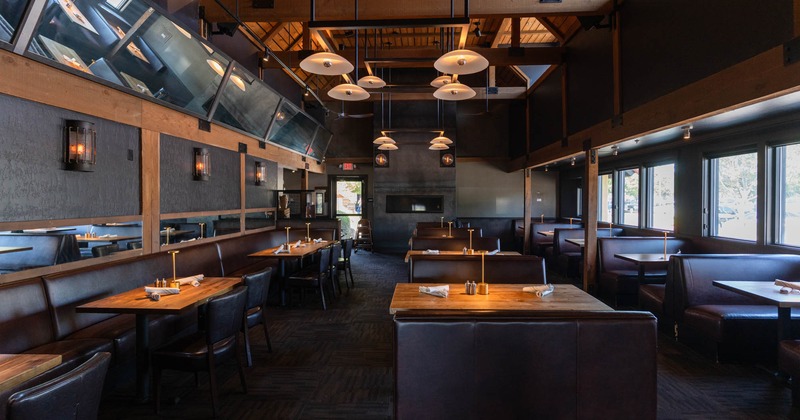 Interior, seating area with tables, chairs and booths