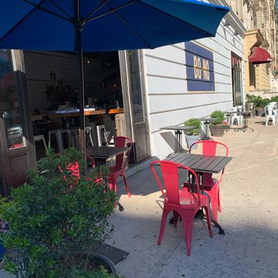 Tables and chairs outside.