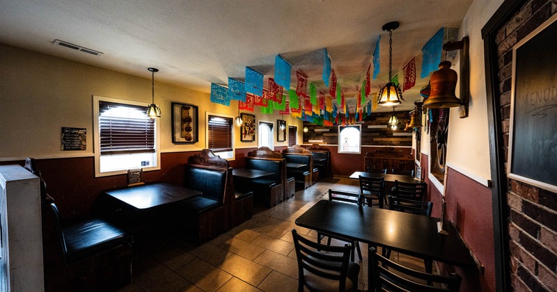 Interior, seating area with booth and tables with chairs
