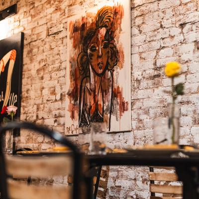 Interior with an artwork on the brick wall.