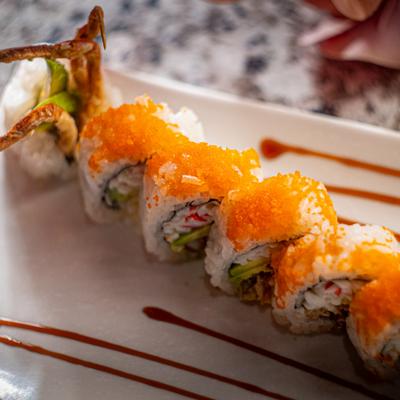 Crab meat sushi rolls topped with roe.