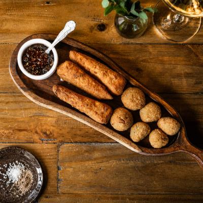 Fried Brie cheese served with fried olives and fig jam.