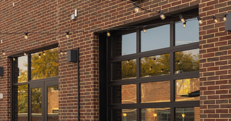 Exterior, angle view to restaurant, entrance, sign above