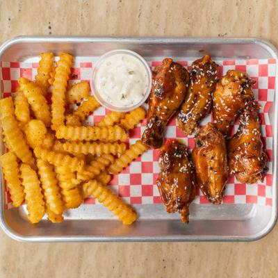 Pringle Town wings served with crinkle cut fries and a creamy suace.