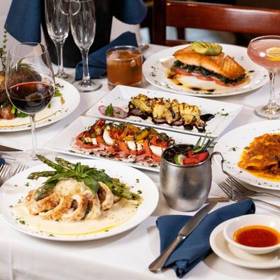 A table spread with food and drinks.