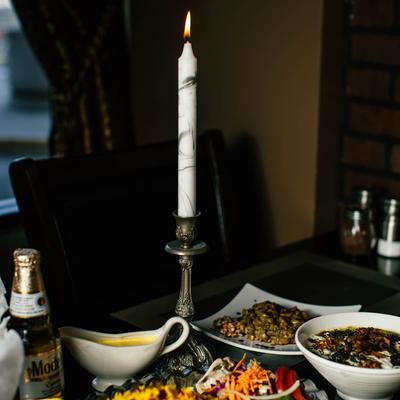 Fully set table with a candle.