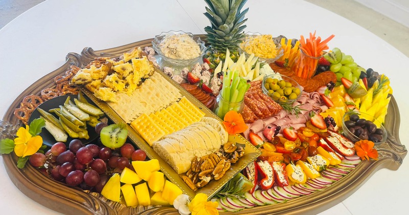 A large charcuterie platter with assorted food items