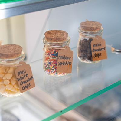 Ice cream display case, ice cream toppings.