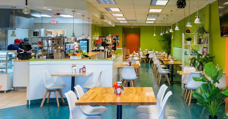 Interior, dining area with order counter and staff working