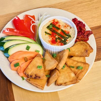 A served hummus plate.