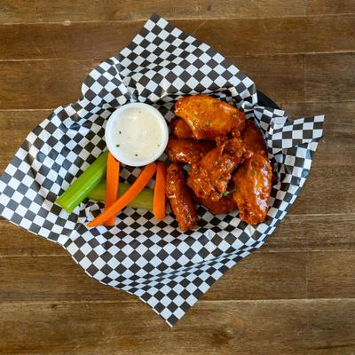 Chicken wings with dip, top view.
