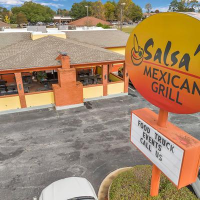Aerial view of the restaurant's exterior with a pole sign and the logo.