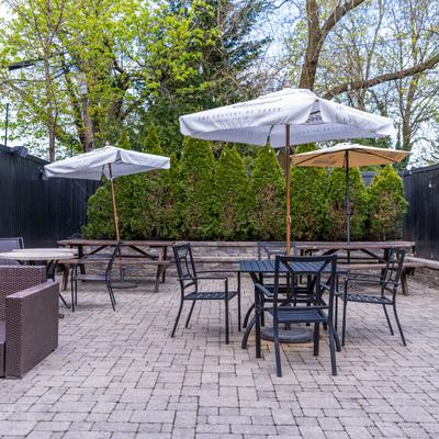 Exterior, seating area, tables covered with parasols.