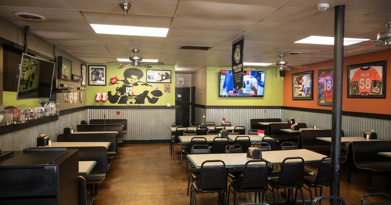 Interior, diner area, tables and chairs, tv on the wall