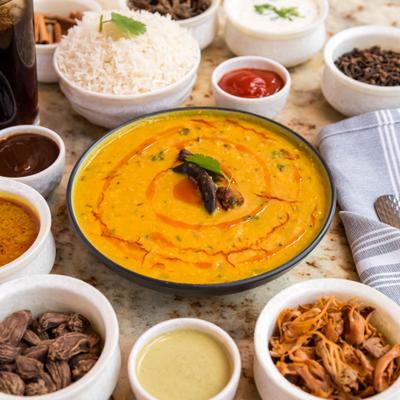 Dal tadka served with other food.