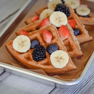Waffles, with berries, and bananas.