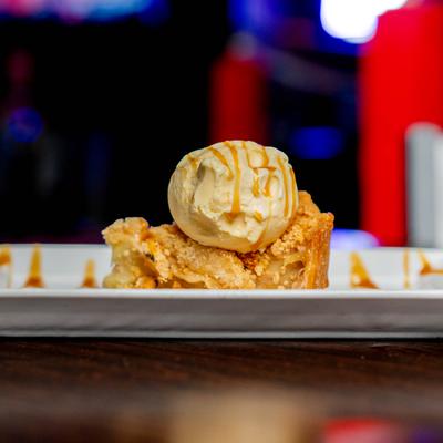 Apple crisp with ice cream.