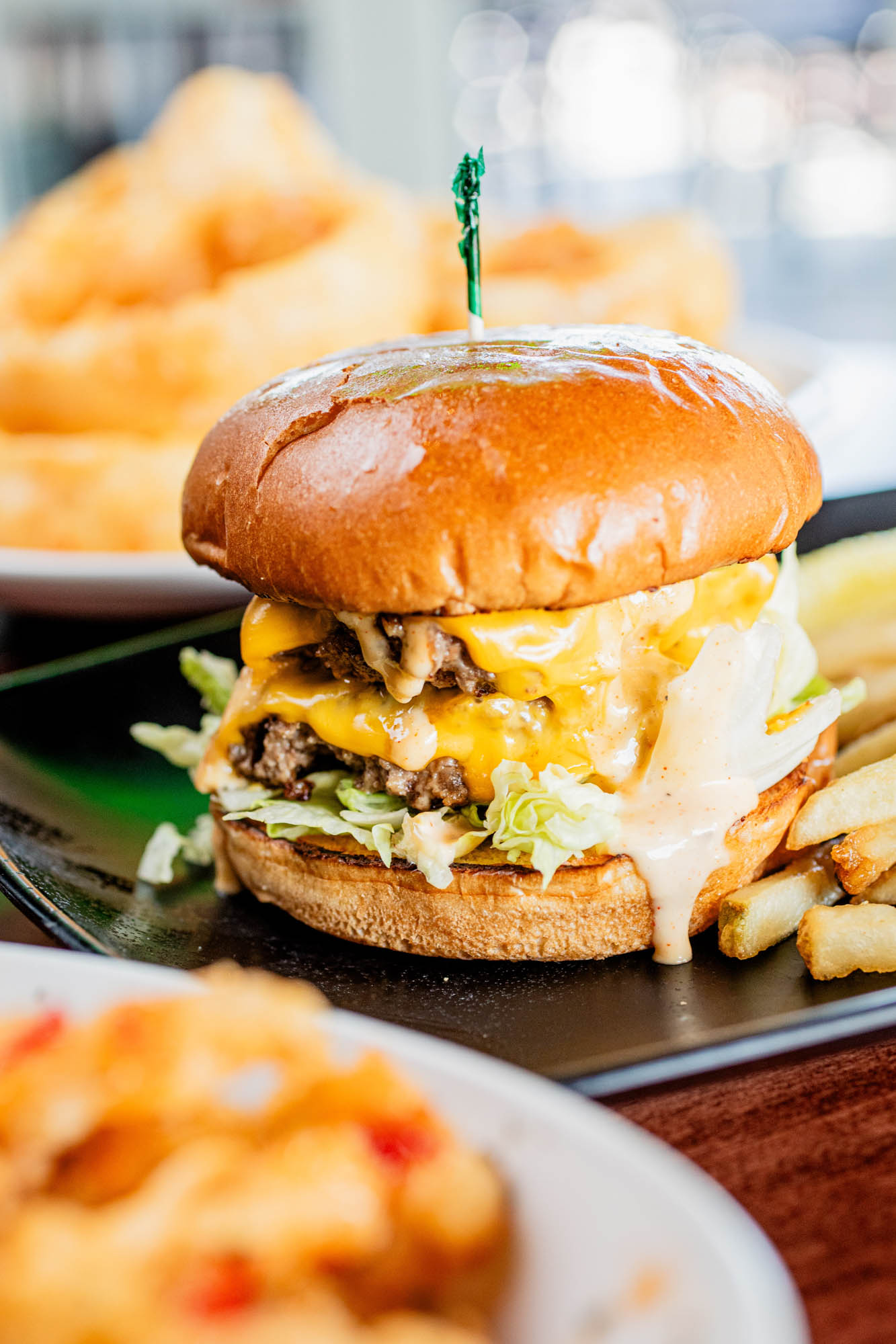Double cheeseburger with lettuce and creamy sauce