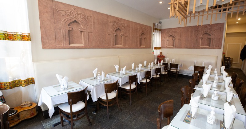 Spacious and cozy interior dining area with set dining tables