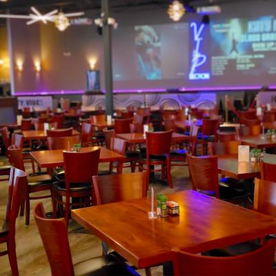 Interior, chairs, tables with condiments and menus.