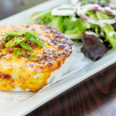 Tomato pie served with green salad