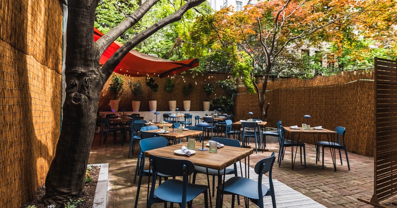 Outdoor, seating area with tables and chairs