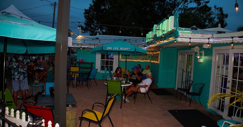 Exterior, patio at night full of guests