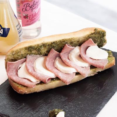 Pesto, salami, and mozzarella sandwich.