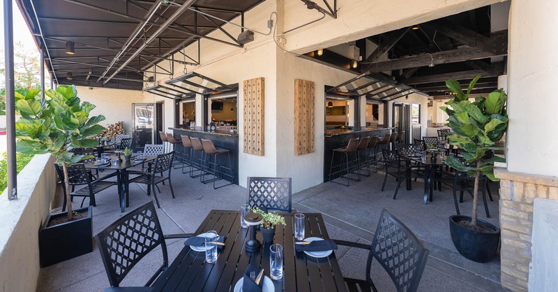 Exterior, tables set for guests on patio